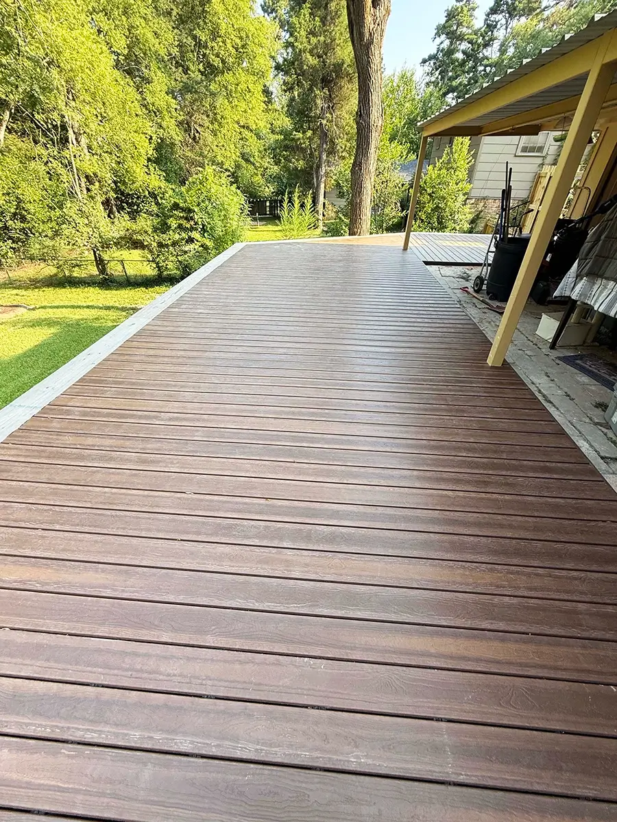 Newly installed wood deck off the side of a home