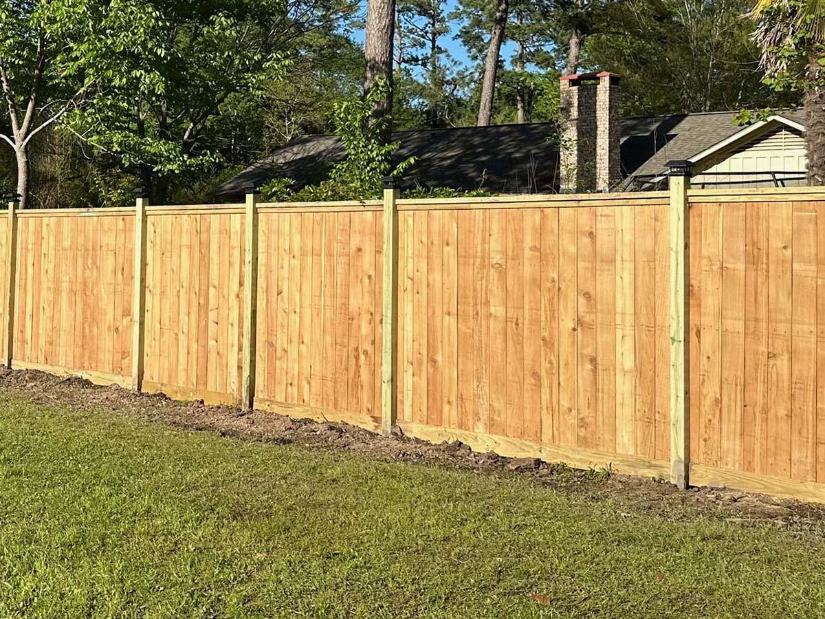 New cedar board-on-board privacy fence with treated pine posts