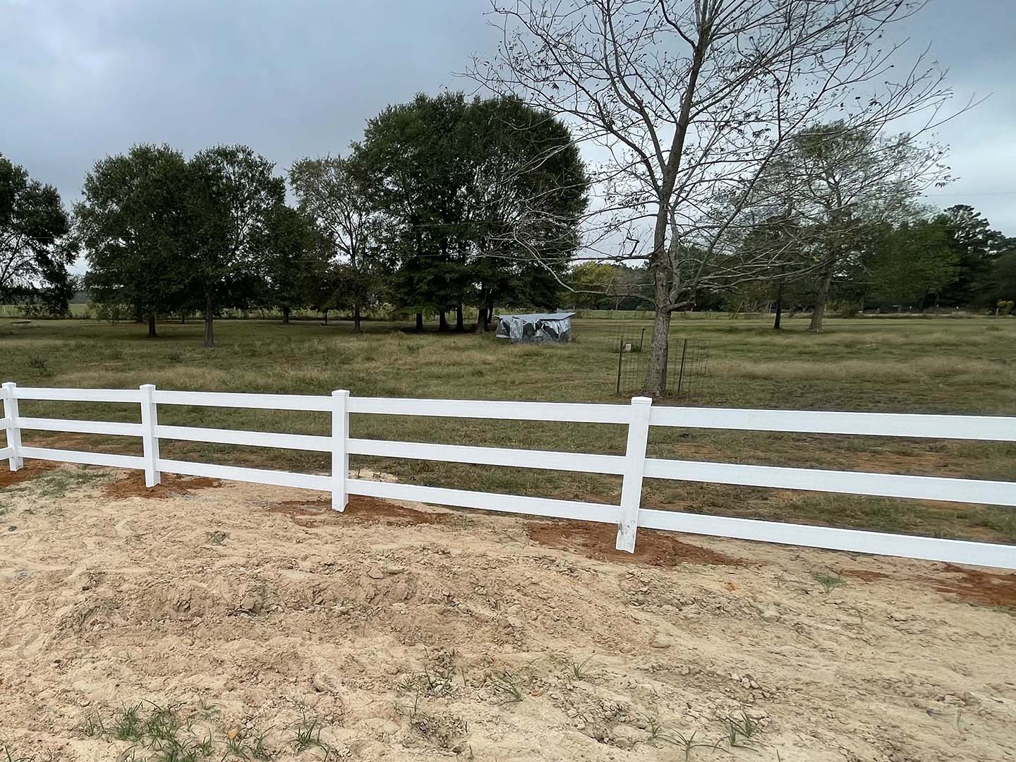 White vinyl farm fence install in Lufkin Texas