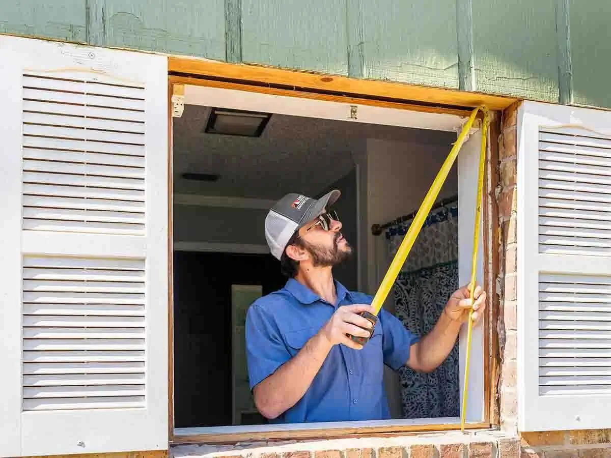 Blume & Son Construction getting ready to install new windows on a home