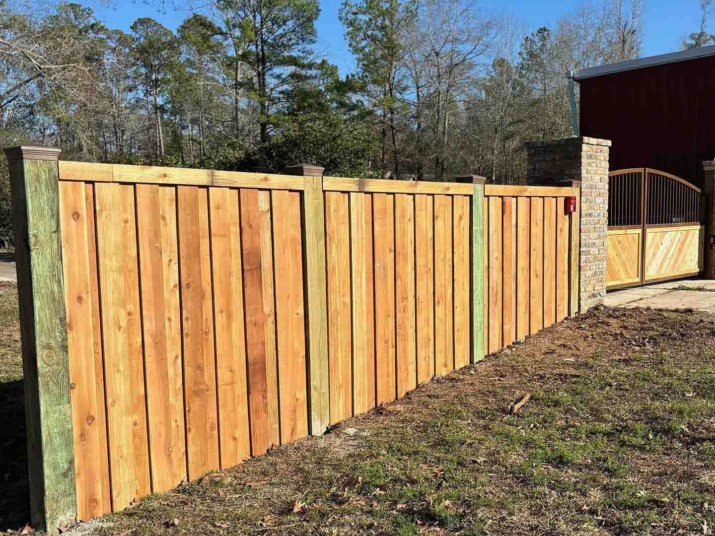 Residential Board on Board Wood Fence With Brick Columns in Lufkin Texas 